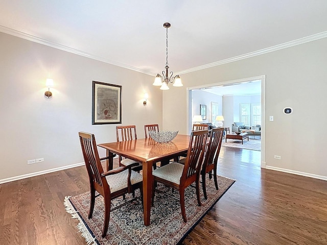 566 Primrose Ln, Crystal Lake, IL 60014 - dining space with dark wood-style floors, a chandelier, and crown molding