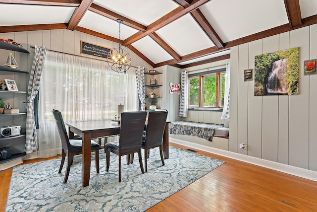 2250 Corona Rd, Waukegan, IL 60087 - dining room featuring a chandelier, hardwood / wood-style flooring, and a decorative wall
