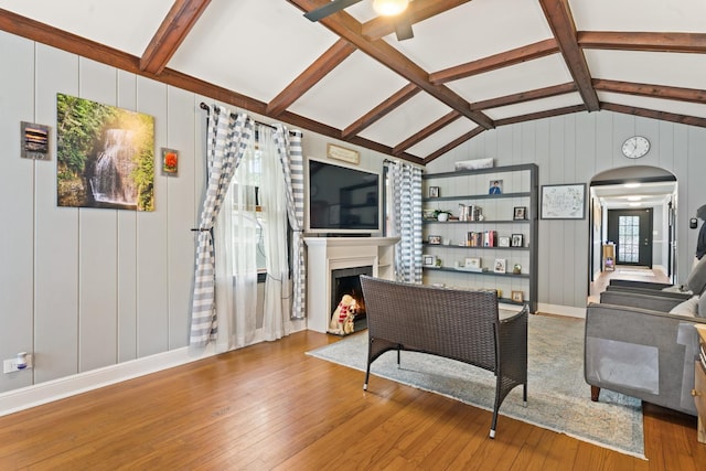 2250 Corona Rd, Waukegan, IL 60087 - living area with hardwood / wood-style floors, arched walkways, a fireplace, and a decorative wall