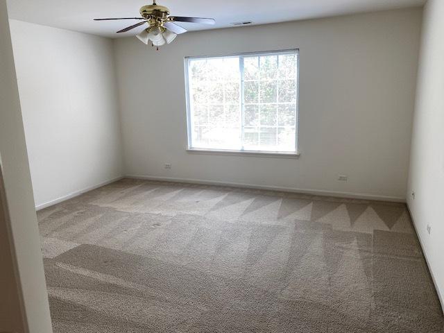 1830 Maureen Dr, Hoffman Estates, IL 60192 - carpeted spare room with ceiling fan and baseboards