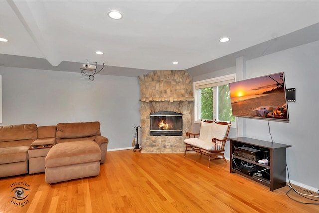 352 Rye Rd, Mundelein, IL 60060 - living room with wood finished floors, a stone fireplace, and recessed lighting