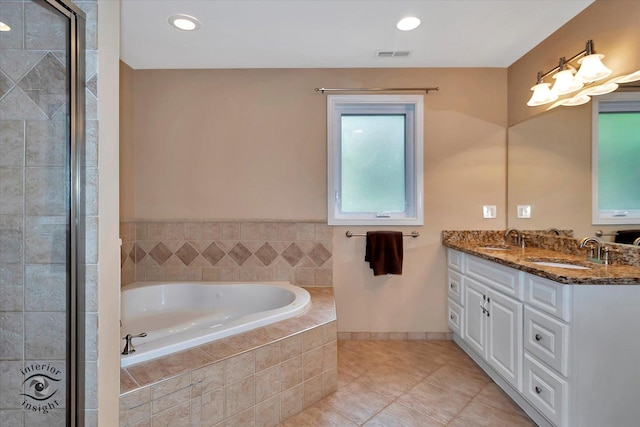 352 Rye Rd, Mundelein, IL 60060 - bathroom featuring a bath, double vanity, tile patterned floors, and recessed lighting