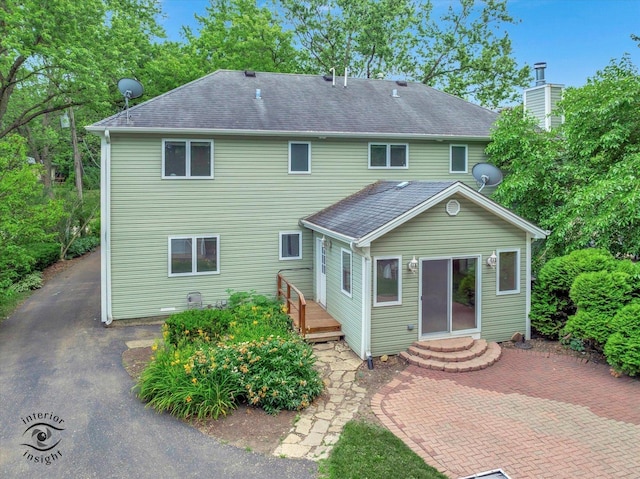 352 Rye Rd, Mundelein, IL 60060 - back of property with a deck, roof with shingles, and a patio area