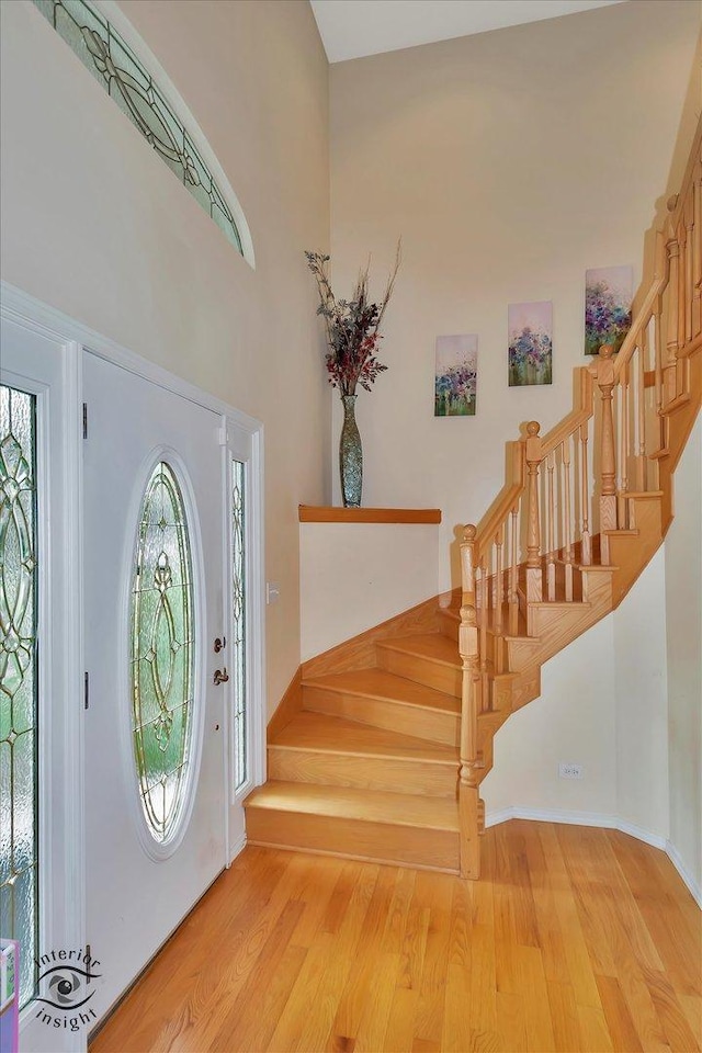 352 Rye Rd, Mundelein, IL 60060 - foyer with stairway, wood finished floors, and a towering ceiling