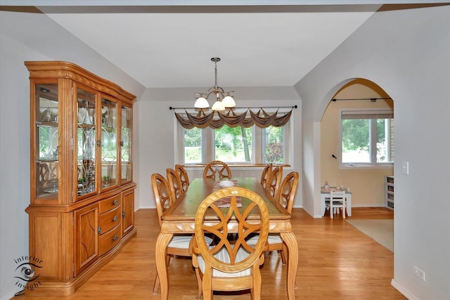 352 Rye Rd, Mundelein, IL 60060 - dining space featuring a chandelier, light wood-style flooring, and arched walkways