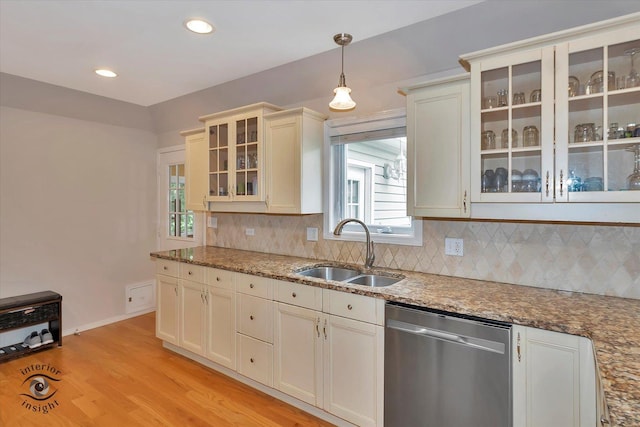 352 Rye Rd, Mundelein, IL 60060 - kitchen with stainless steel dishwasher, backsplash, hanging light fixtures, light wood finished floors, and plenty of natural light