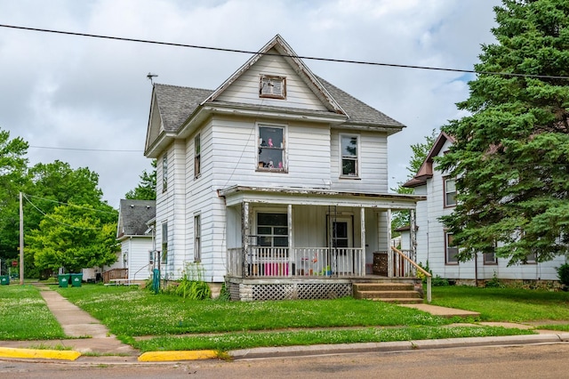 415 S Franklin Ave, Polo, IL 61064 - view of front of house featuring covered porch, a shingled roof, and a front lawn