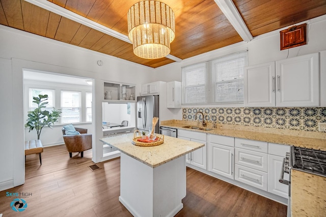1659 N Francisco Ave, Chicago, IL 60647 - kitchen featuring wood ceiling, stainless steel appliances, a chandelier, white cabinets, and a kitchen island