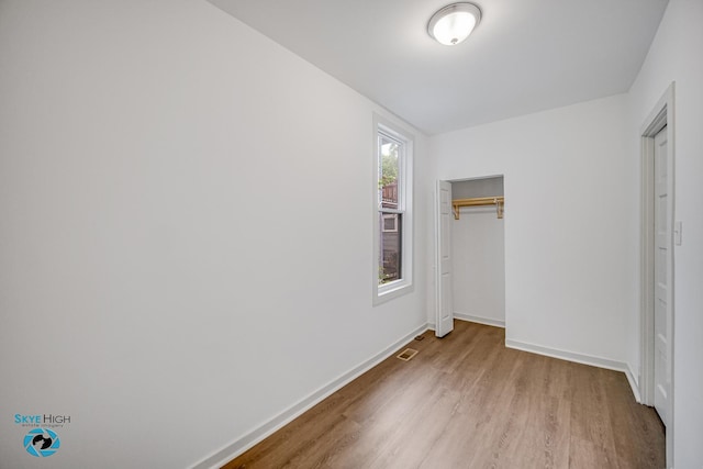 1659 N Francisco Ave, Chicago, IL 60647 - unfurnished bedroom featuring light wood-style floors and a closet