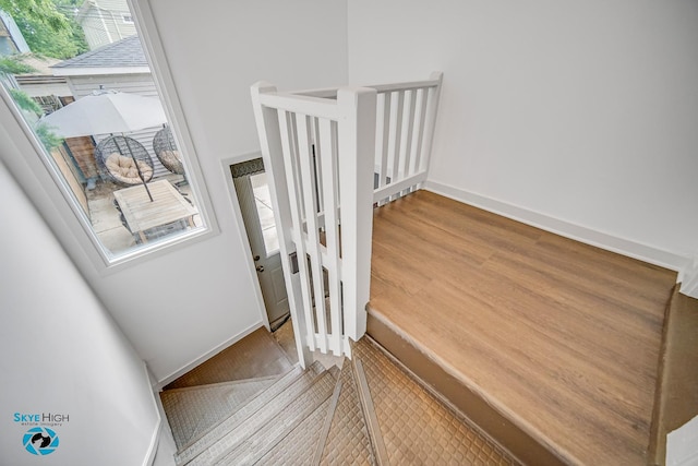 1659 N Francisco Ave, Chicago, IL 60647 - stairway with healthy amount of natural light and wood finished floors