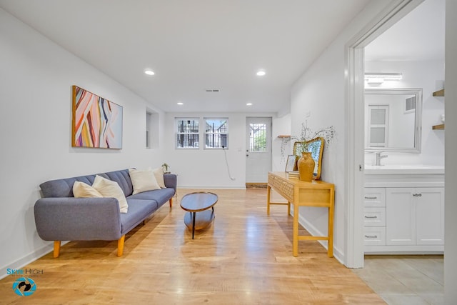 1659 N Francisco Ave, Chicago, IL 60647 - living area featuring light wood-style flooring and recessed lighting