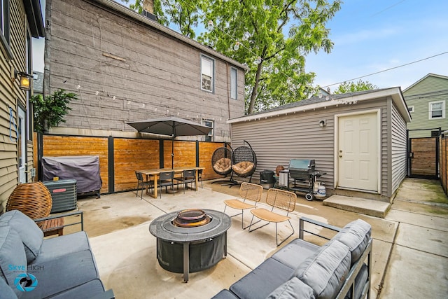 1659 N Francisco Ave, Chicago, IL 60647 - fenced backyard with an outdoor living space with a fire pit, outdoor dining area, a patio, and area for grilling