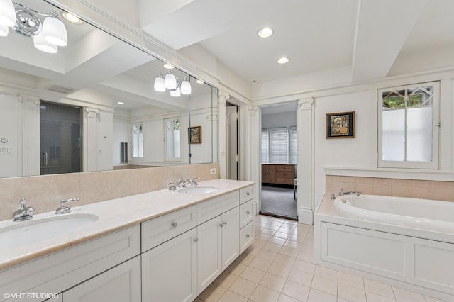 938 Edgemere Ct, Evanston, IL 60202 - bathroom featuring tile patterned flooring, double vanity, a garden tub, and recessed lighting