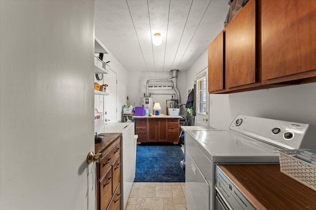 1356 Briarcliff Dr, Rantoul, IL 61866 - laundry room featuring washing machine and clothes dryer, cabinet space, carpet flooring, and water heater