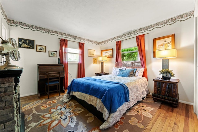 1356 Briarcliff Dr, Rantoul, IL 61866 - bedroom with multiple windows and wood-type flooring