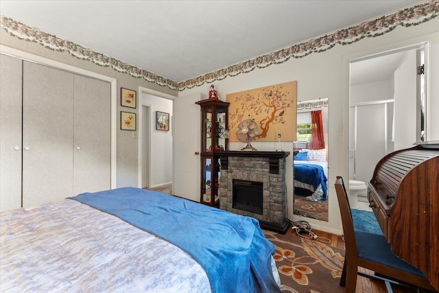1356 Briarcliff Dr, Rantoul, IL 61866 - bedroom featuring a closet and a stone fireplace