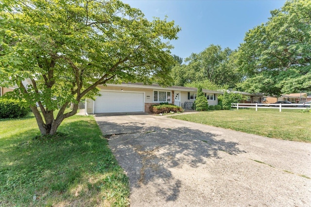1356 Briarcliff Dr, Rantoul, IL 61866 - ranch-style home featuring a garage, driveway, and brick siding