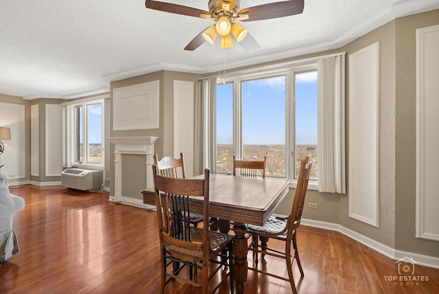 1 Renaissance Pl Unit 1121, Palatine, IL 60067 - dining room featuring a textured ceiling, wood finished floors, a wall unit AC, and ceiling fan