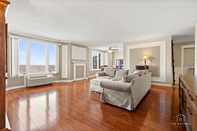 1 Renaissance Pl Unit 1121, Palatine, IL 60067 - living room featuring a textured ceiling, an AC wall unit, dark wood-style flooring, and a ceiling fan