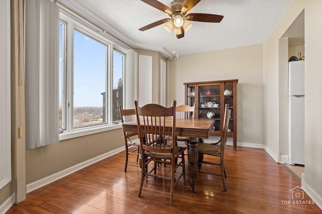 1 Renaissance Pl Unit 1121, Palatine, IL 60067 - dining area featuring healthy amount of natural light, wood finished floors, ceiling fan, and a textured ceiling