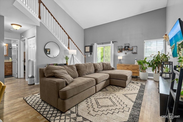 1005 Georgian Pl Unit 1005, Bartlett, IL 60103 - living area featuring a high ceiling, wood finished floors, and stairway