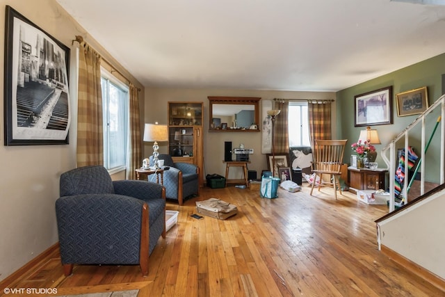 1152 Greensfield Dr, Naperville, IL 60563 - living room featuring healthy amount of natural light, wood-type flooring, and stairway