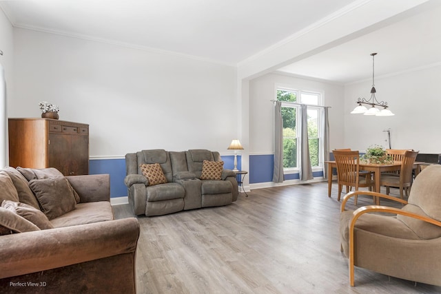 2320 Barrett Dr, Algonquin, IL 60102 - living area with light wood finished floors, ornamental molding, and a chandelier
