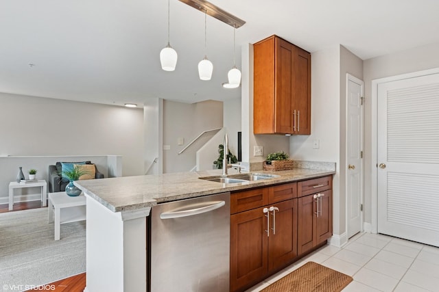 926 Bromley Pl, Northbrook, IL 60062 - kitchen featuring stainless steel dishwasher, brown cabinets, decorative light fixtures, open floor plan, and light stone counters