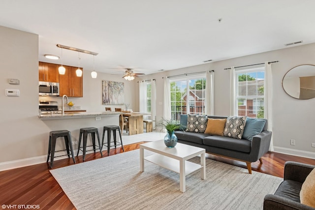 926 Bromley Pl, Northbrook, IL 60062 - living area with dark wood-type flooring and ceiling fan