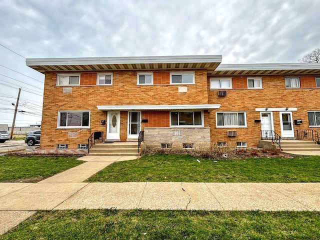8664 Gregory Ln Unit E, Des Plaines, IL 60016 - view of property featuring a front lawn and brick siding