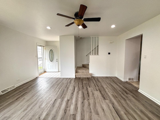 8664 Gregory Ln Unit E, Des Plaines, IL 60016 - unfurnished living room featuring wood finished floors, a ceiling fan, recessed lighting, and stairway