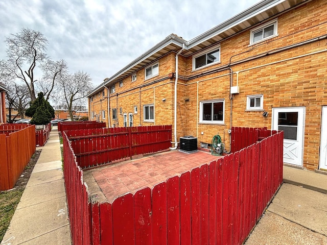 8664 Gregory Ln Unit E, Des Plaines, IL 60016 - back of property featuring a patio area