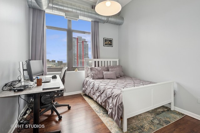 212 E Cullerton St Unit Ph06, Chicago, IL 60616 - bedroom with wood finished floors, multiple windows, and an office area