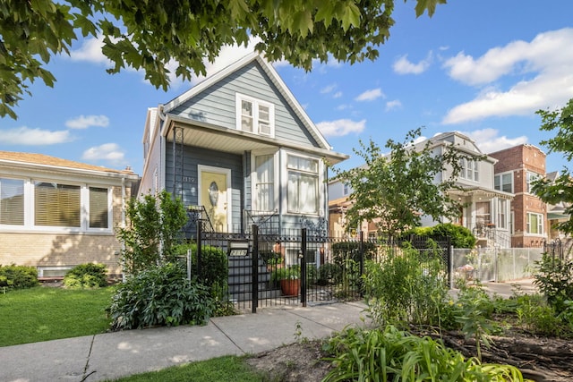2119 N Karlov Ave, Chicago, IL 60639 - view of front of home with a fenced front yard and a gate