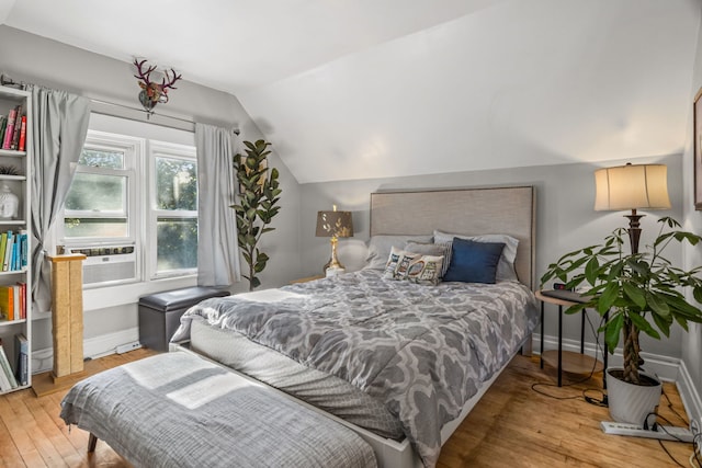 2119 N Karlov Ave, Chicago, IL 60639 - bedroom with vaulted ceiling, light wood-type flooring, and cooling unit