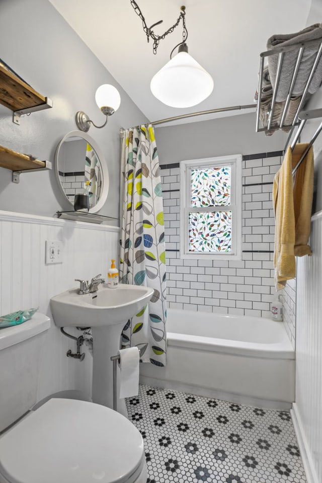 2119 N Karlov Ave, Chicago, IL 60639 - bathroom with shower / bath combo, wainscoting, and tile patterned floors