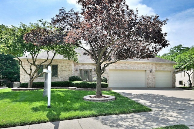 121 Rose Dr, Bloomingdale, IL 60108 - obstructed view of property with concrete driveway, a garage, brick siding, and a front lawn