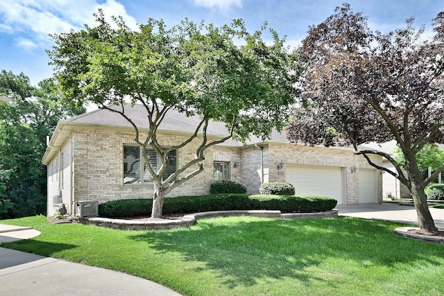 121 Rose Dr, Bloomingdale, IL 60108 - view of front of house featuring brick siding, a front lawn, driveway, and a garage