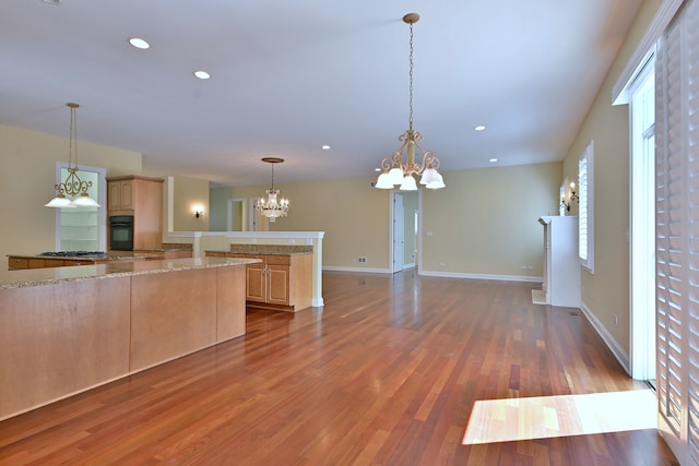 121 Rose Dr, Bloomingdale, IL 60108 - kitchen featuring light brown cabinetry, black oven, a chandelier, wood finished floors, and recessed lighting