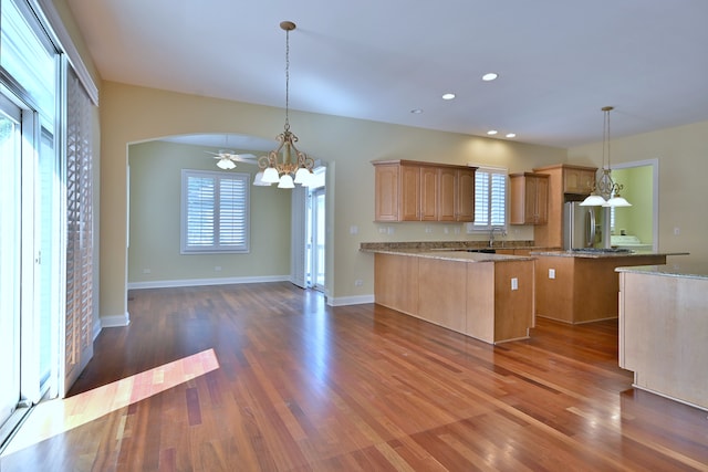 121 Rose Dr, Bloomingdale, IL 60108 - kitchen with stainless steel fridge with ice dispenser, a peninsula, a chandelier, dark wood-style flooring, and recessed lighting