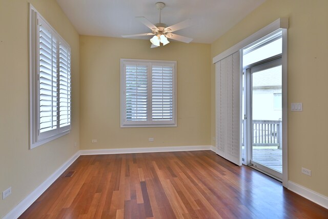 121 Rose Dr, Bloomingdale, IL 60108 - unfurnished room with wood finished floors, plenty of natural light, and ceiling fan