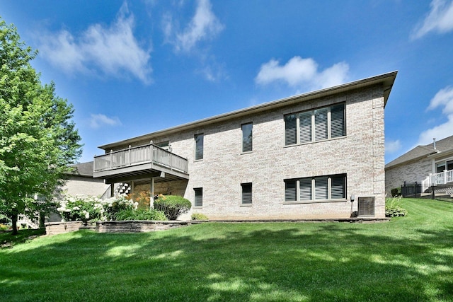 121 Rose Dr, Bloomingdale, IL 60108 - back of house with brick siding, a yard, and a wooden deck