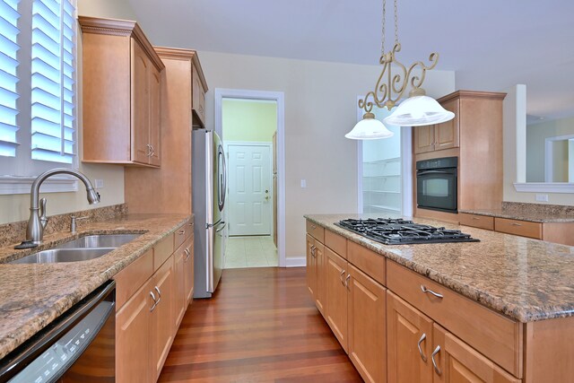 121 Rose Dr, Bloomingdale, IL 60108 - kitchen featuring black appliances, dark wood-type flooring, light stone countertops, a center island, and pendant lighting
