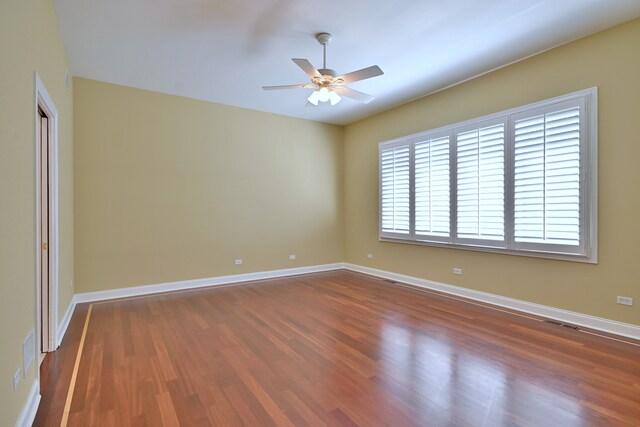 121 Rose Dr, Bloomingdale, IL 60108 - unfurnished room featuring a ceiling fan and dark wood-style flooring