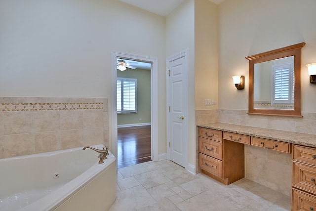 121 Rose Dr, Bloomingdale, IL 60108 - bathroom featuring a jetted tub, vanity, and a ceiling fan