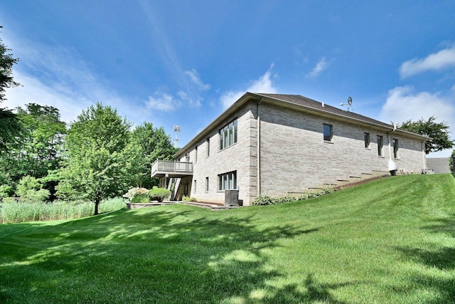 121 Rose Dr, Bloomingdale, IL 60108 - back of house with a yard, brick siding, and a wooden deck