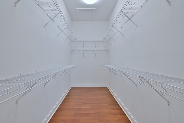 121 Rose Dr, Bloomingdale, IL 60108 - spacious closet with dark wood-style floors and attic access