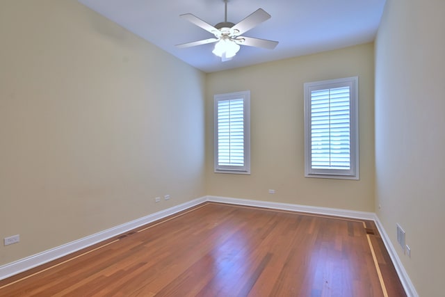 121 Rose Dr, Bloomingdale, IL 60108 - spare room featuring dark wood-style flooring and ceiling fan