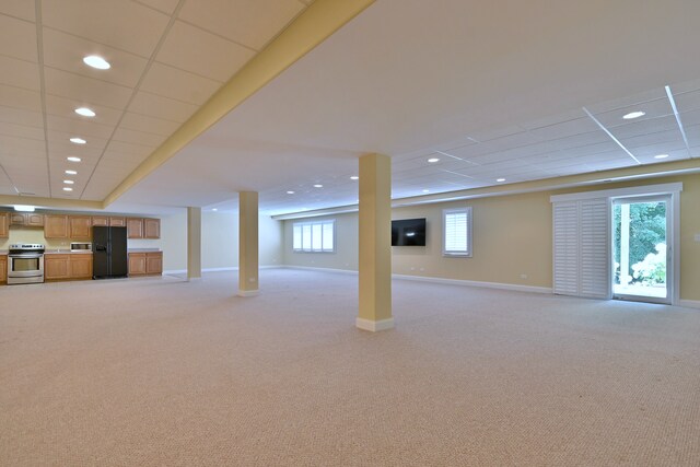 121 Rose Dr, Bloomingdale, IL 60108 - below grade area with black refrigerator with ice dispenser, light carpet, and recessed lighting