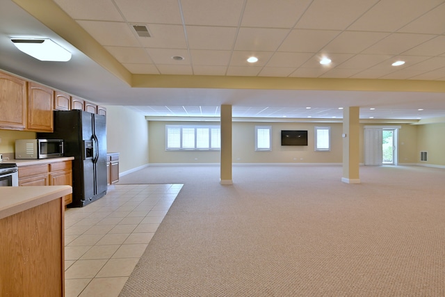 121 Rose Dr, Bloomingdale, IL 60108 - kitchen with stainless steel microwave, black fridge with ice dispenser, open floor plan, light carpet, and recessed lighting